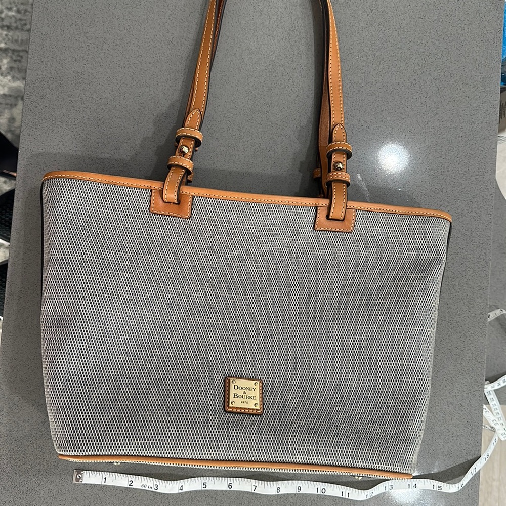 Dooney & Bourke navy/white checkered tote with tan piping. Great condition